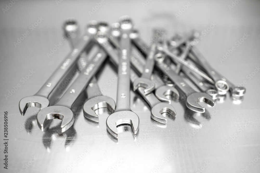 Pile of a new car wrenches on the stainless table Pile of a new car wrenches on the stainless table