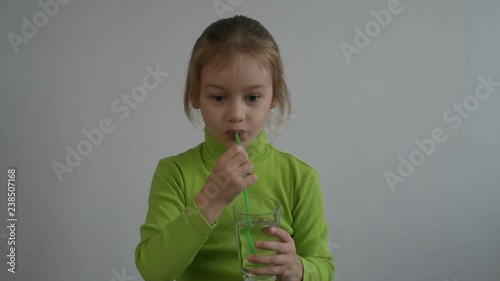 Little girl with a glass of water