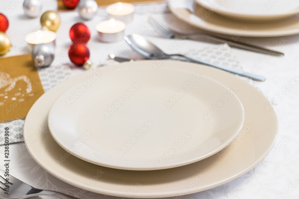 Closeup on empty plate on Christmas Eve table Closeup on empty plate on Christmas Eve table
