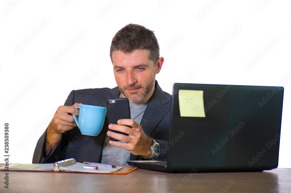 isolated portrait of young successful and attractive businessman working at office computer desk satisfied and relaxed in financial business success isolated portrait of young successful and attractive businessman working at office computer desk satisfied and relaxed in financial business success