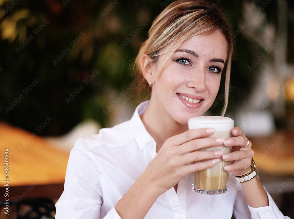 woman drinking coffee in the morning at restaurant woman drinking coffee in the morning at restaurant