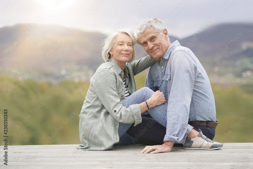 Loving full length portrait of modern senior couple outdoors Loving full length portrait of modern senior couple outdoors