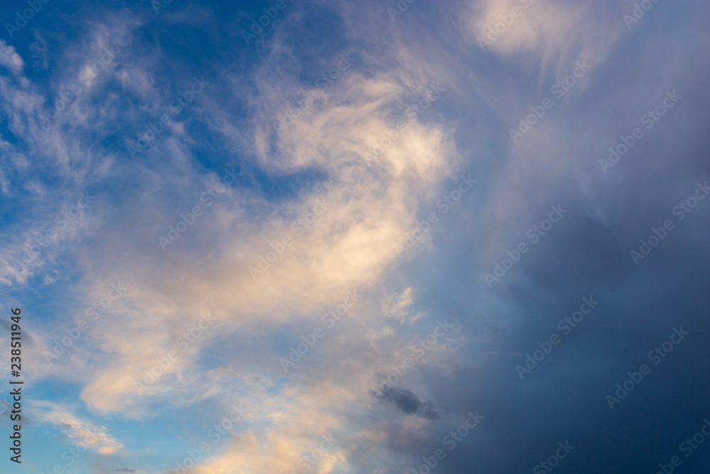 Clouds after rain before sunset as a background