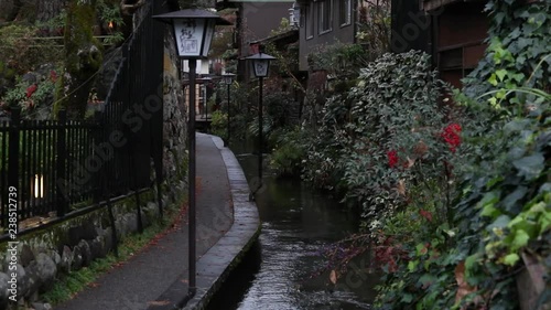 A path and stream with atmosphere.  Slow motion. photo