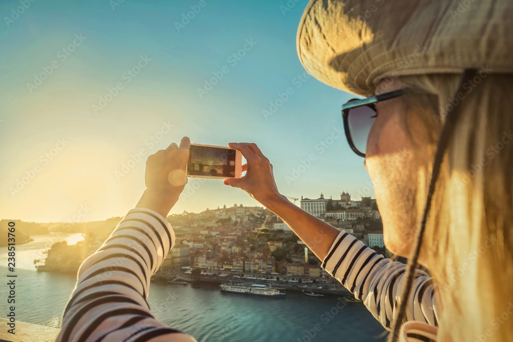 Happy blonde woman - tourist shot on her smartphone camera - obrazy, fototapety, plakaty 