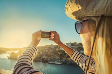 Happy blonde woman - tourist shot on her smartphone camera