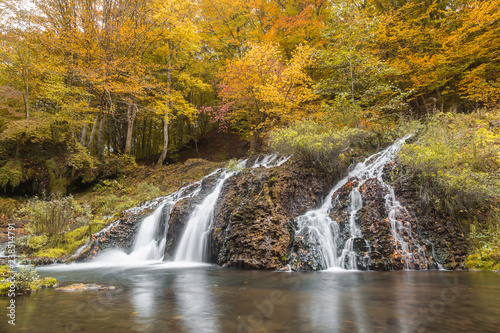 Fototapeta Naklejka Na Ścianę i Meble -  Waterfall in the forest in autumn season