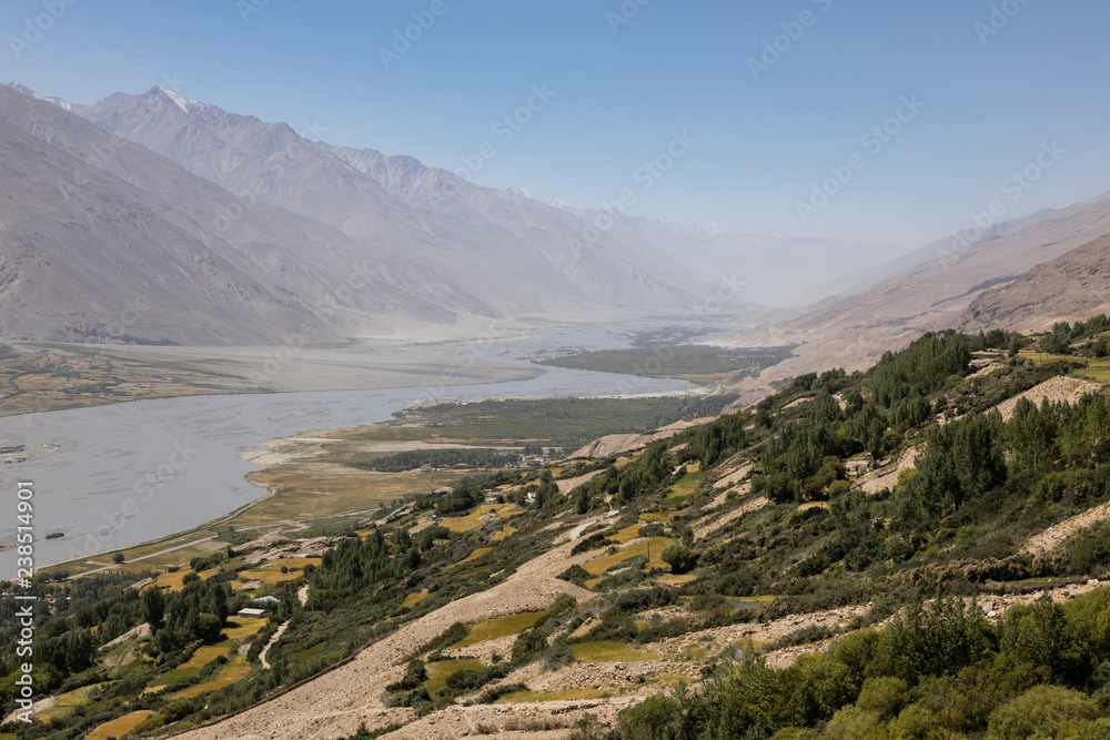 Fertile Wakhan Valley near Vrang in Tajikistan. The mountains in the background are the Hindu Kush in Afghanistan