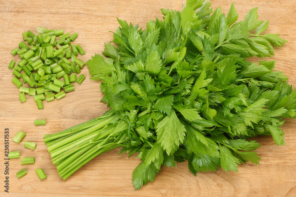 celery leaves on wooden table. Healthy food. celery leaves on wooden table. Healthy food.