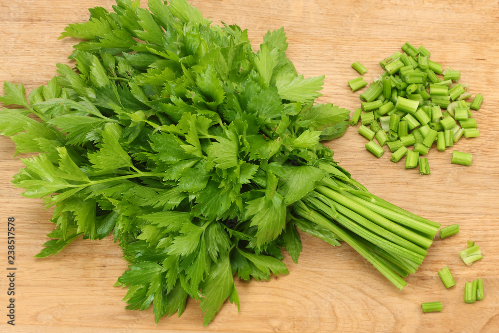 celery leaves on wooden table. Healthy food. celery leaves on wooden table. Healthy food.