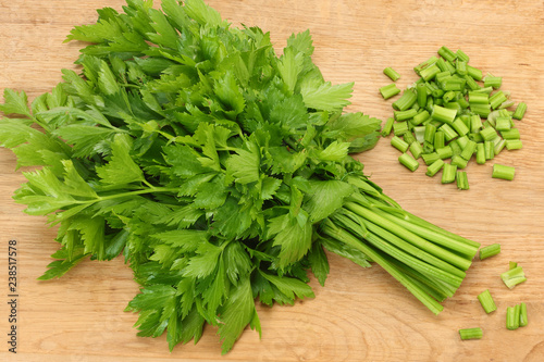 celery leaves on wooden table. Healthy food.