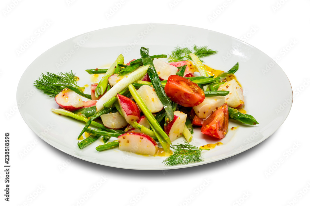 Vegetable salad with green onion radish and tomatoes. On a white plate and a white background Vegetable salad with green onion radish and tomatoes. On a white plate and a white background
