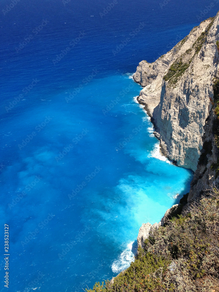 amazing view of turquoise water of Zakhyntos crushing in the rocks