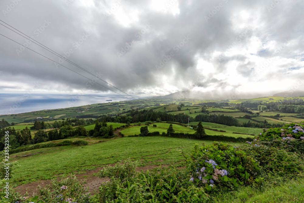 Fototapeta premium Beautiful view of the dramatic cloudscape above Vila Franca do Campo on Sao Miguel, Portugal.