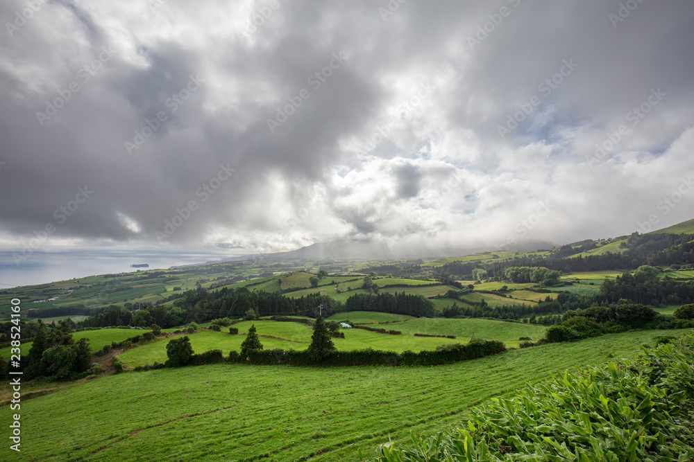 Clouds putting on a show above the beautiful countryside on Sao Miguel island in the Azores.