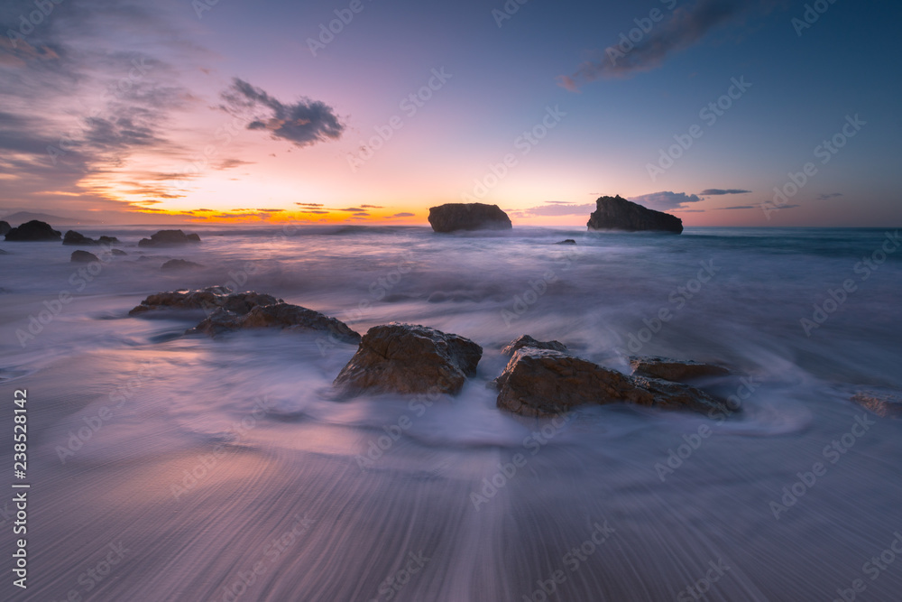 Obraz premium Sea hitting the rocks of Ilbarritz coast at the city of Biarritz, Basque Country,.