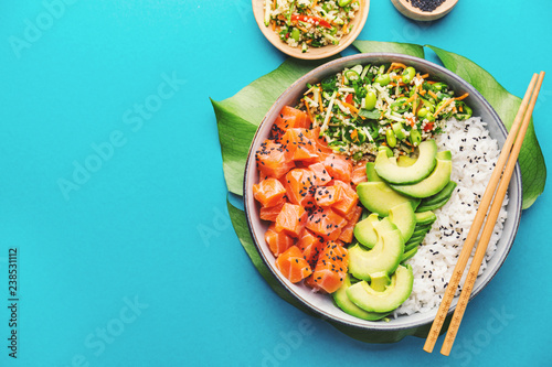 Poke bowl with salmon served in bowl