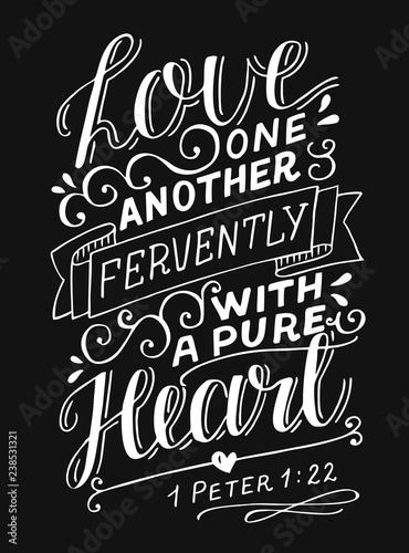 Hand lettering with bible verse Love one another fervently with a pure heart on black background. photo