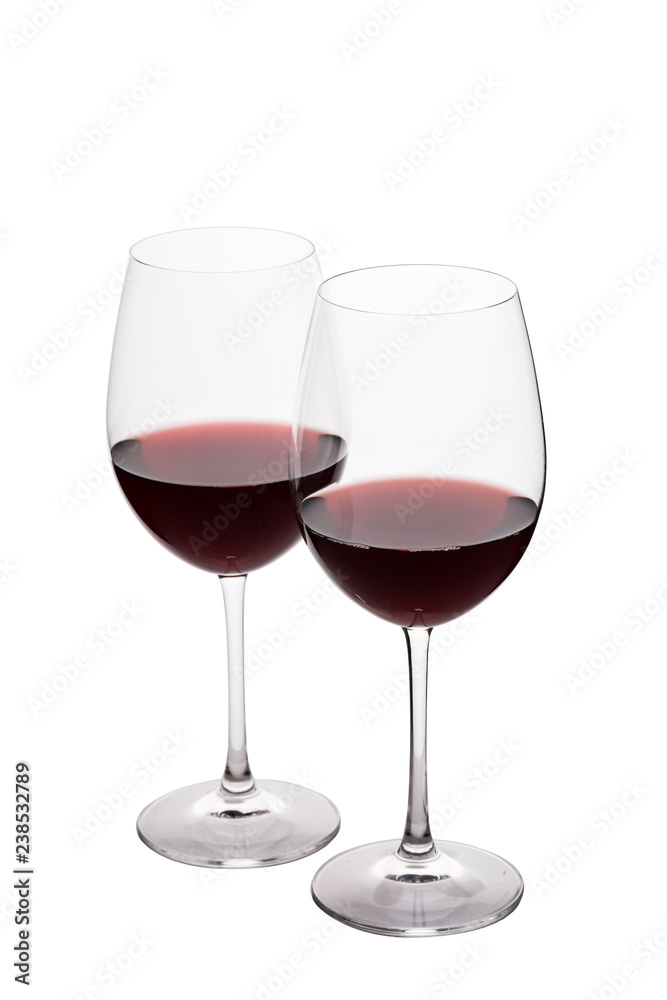 Two red wine glasses on the white background