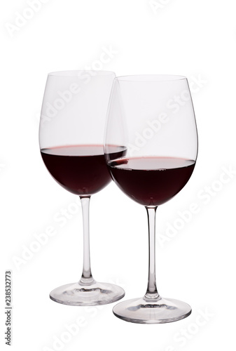Two red wine glasses on the white background