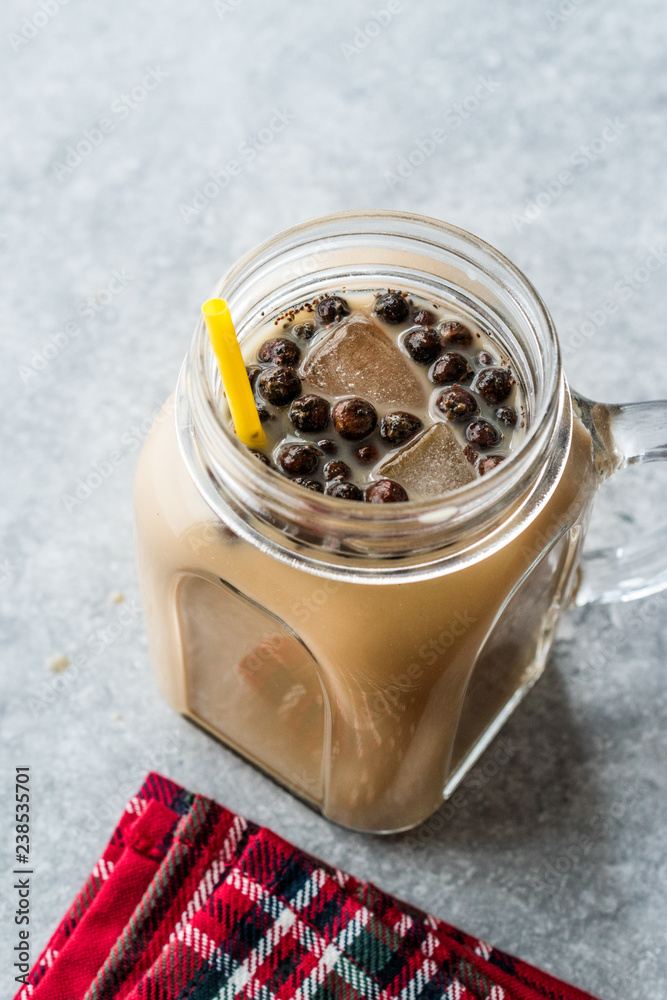 Homemade Milk Bubble Tea with Tapioca Pearls in Mason Jar. Homemade Milk Bubble Tea with Tapioca Pearls in Mason Jar.