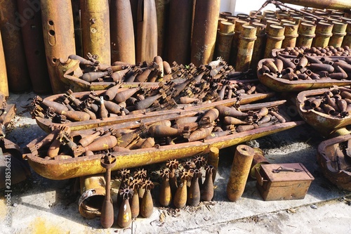 Rusted munitions, bomb housings and unexploded ordnance recovered and disarmed in rural Laos photo