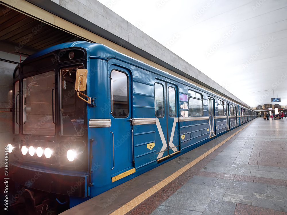 Metro train arrived at the station. Wagons of subway in underground. Subway station. Public speed transport concept.