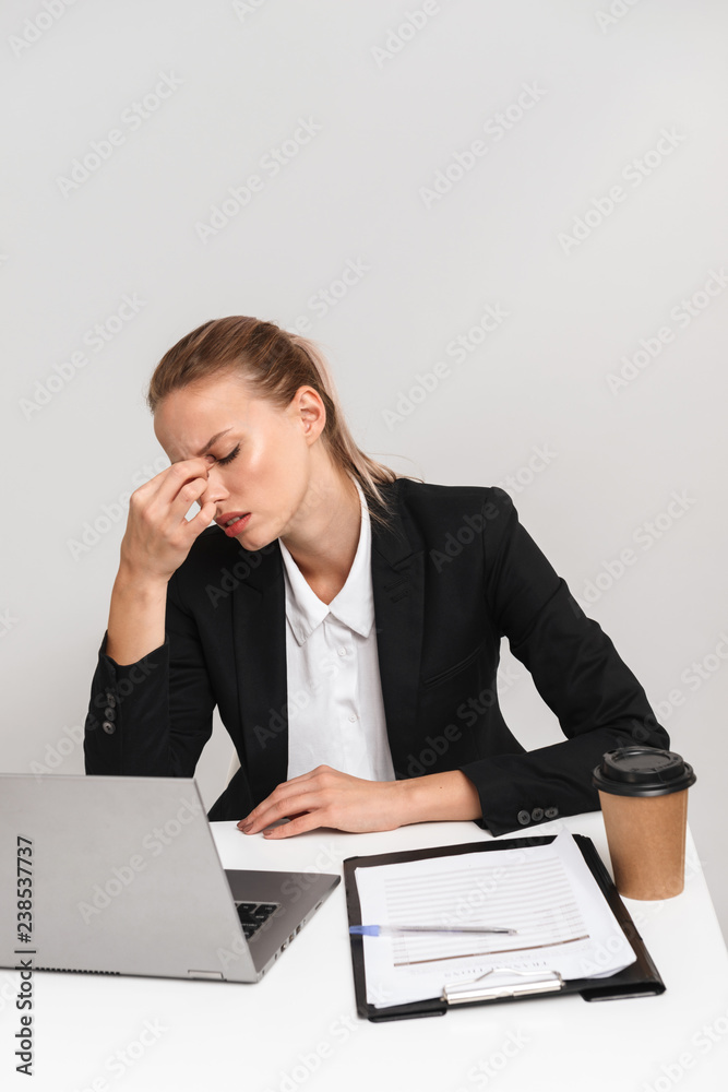 Exhausted young business woman wearing suit Exhausted young business woman wearing suit