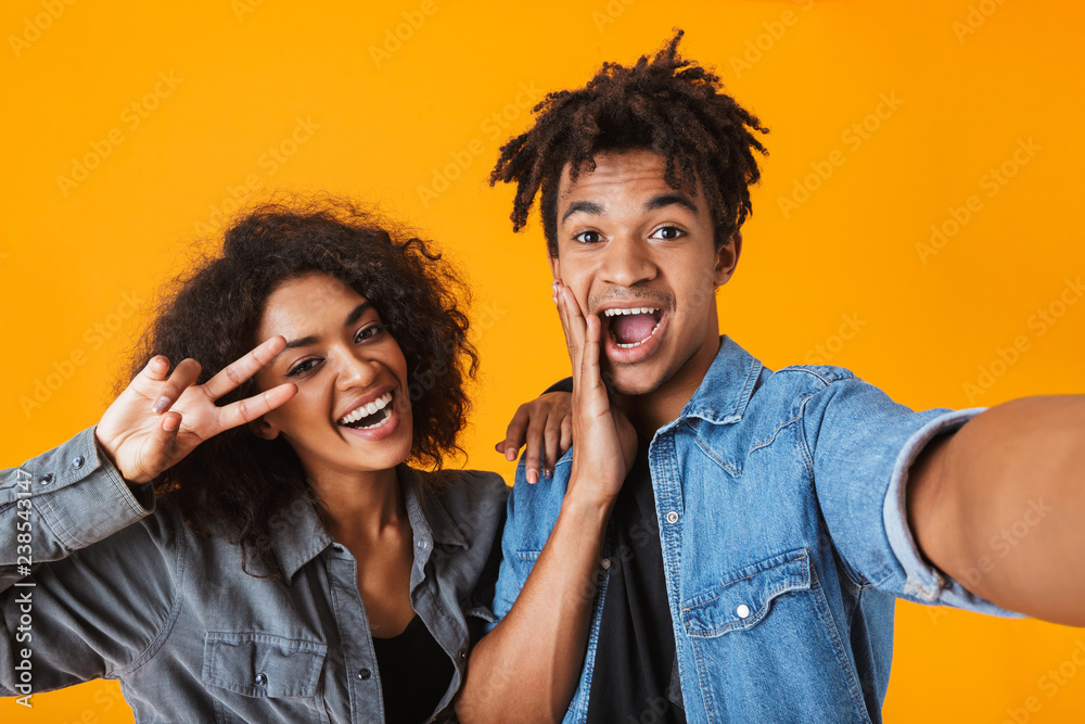 Cheerful young african couple standing Cheerful young african couple standing