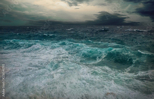 Stormy sea view  near coastline at evening time. Waves  splashed