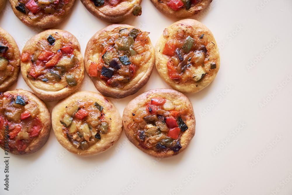 Freshly baked mini pizzas Cocas Freshly baked mini pizzas Cocas