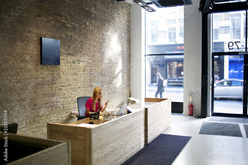 Business receptionist at concierge desk