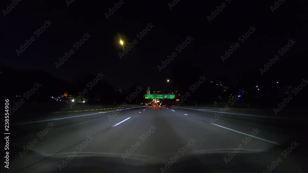 Night driving view Downtown, Civic Center and 101 interchange highway signs on Harbor 110 freeway in Los Angeles, California. Night driving view Downtown, Civic Center and 101 interchange highway signs on Harbor 110 freeway in Los Angeles, California.