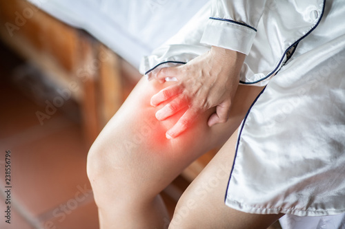 Fotografie Woman itch Thigh and scratch and have problem with skin,Skincare Concept