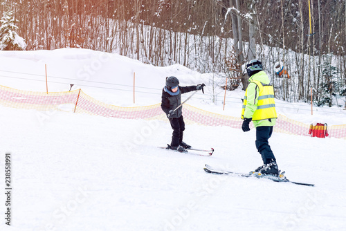 Learning a boy to ski. Carpathians.