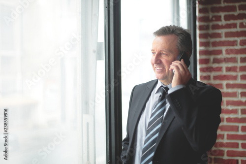 smiling business men talking on the phone