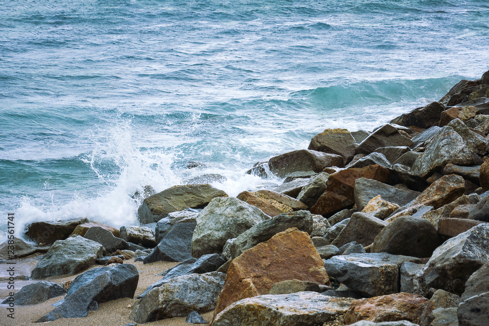 Stone In Green Sea With Wave