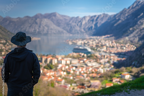 Tourist admiring Kotor town and Bay from above