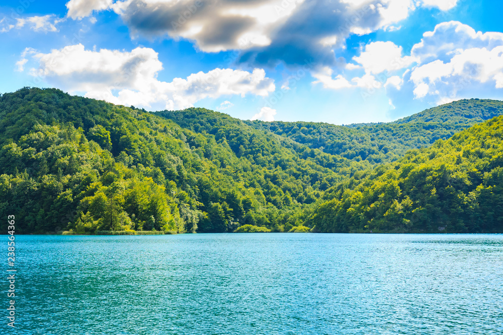 Mountain landscape with mountains forests and water. Plitvice lakes, Croatia Mountain landscape with mountains forests and water. Plitvice lakes, Croatia