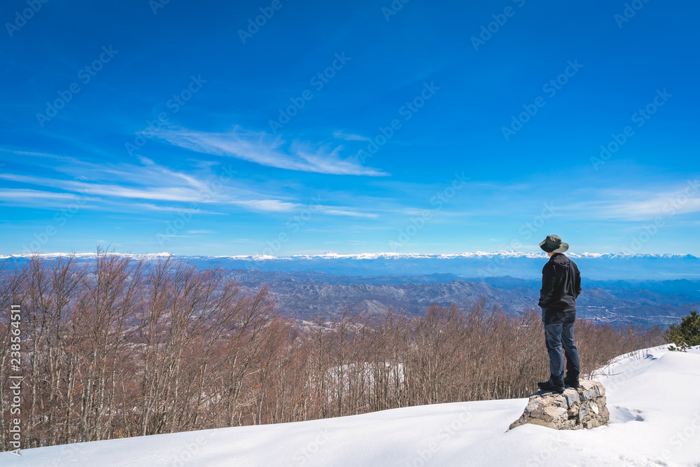 Man admiring the winter beauty of Lovcen NP