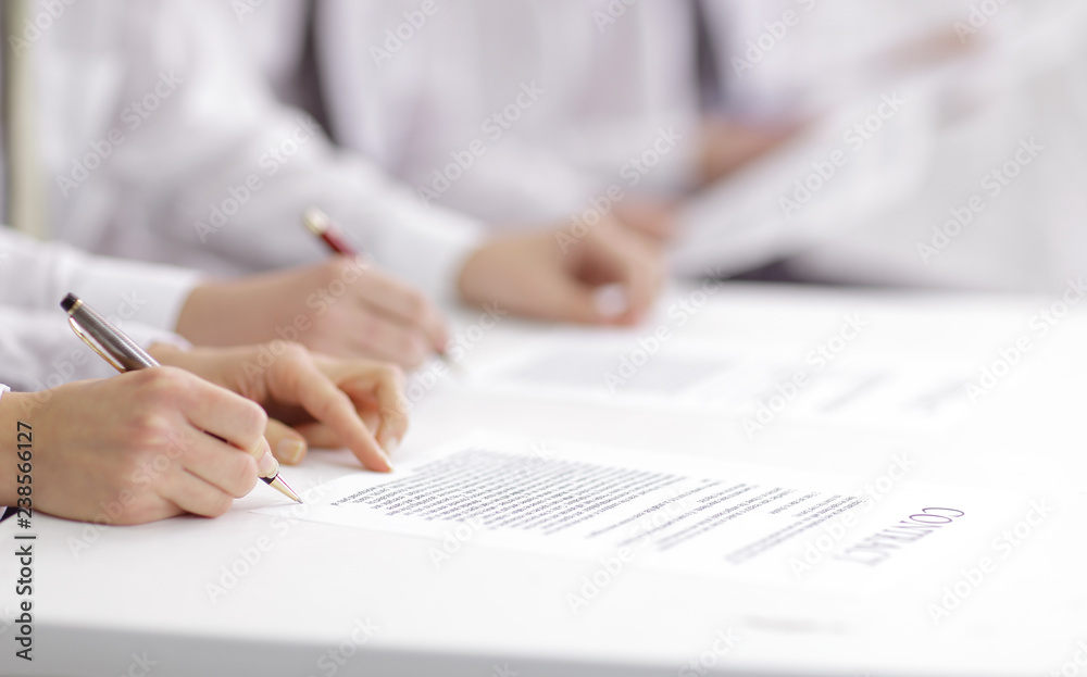 close up. business team studying the terms of the contract