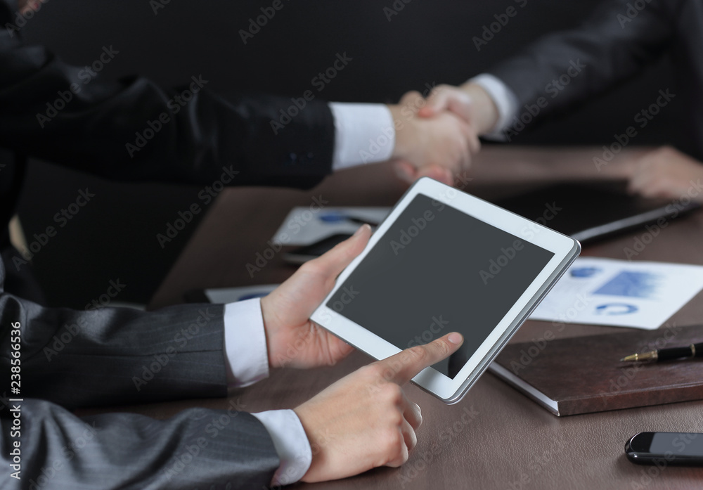 businessman uses a digital tablet at a briefing in the office businessman uses a digital tablet at a briefing in the office