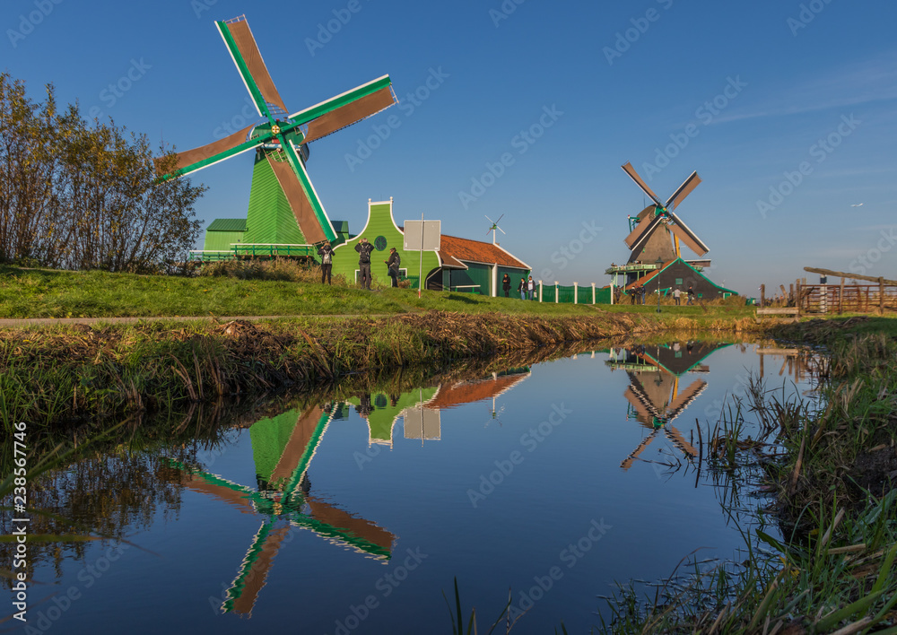 Fototapeta premium Zaanse Schans, Netherlands - considered a real open air museum, Zaanse Schans presents a collection of well-preserved historic windmills and houses
