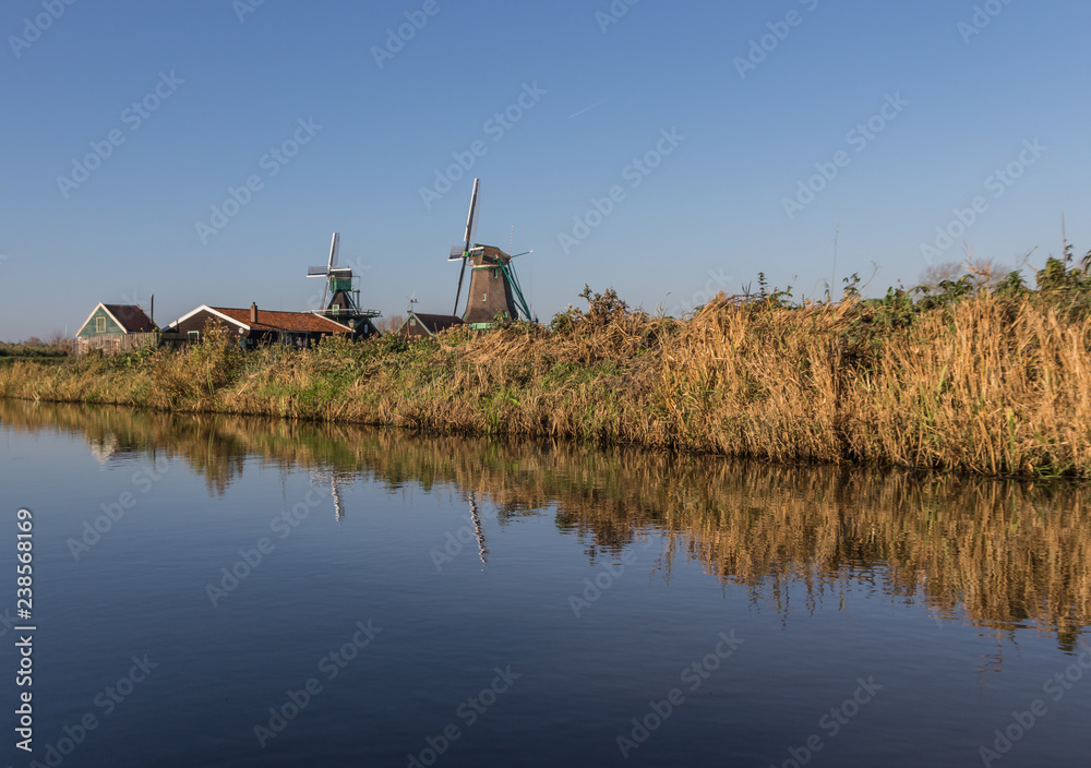 Fototapeta premium Zaanse Schans, Netherlands - considered a real open air museum, Zaanse Schans presents a collection of well-preserved historic windmills and houses