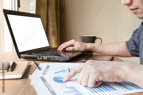 business man analyzing graph and chart document