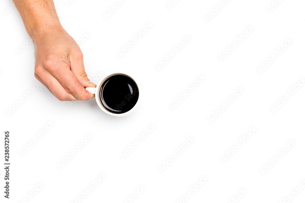 men's hands holding a white cup of coffee on white isolated background, place for text men's hands holding a white cup of coffee on white isolated background, place for text