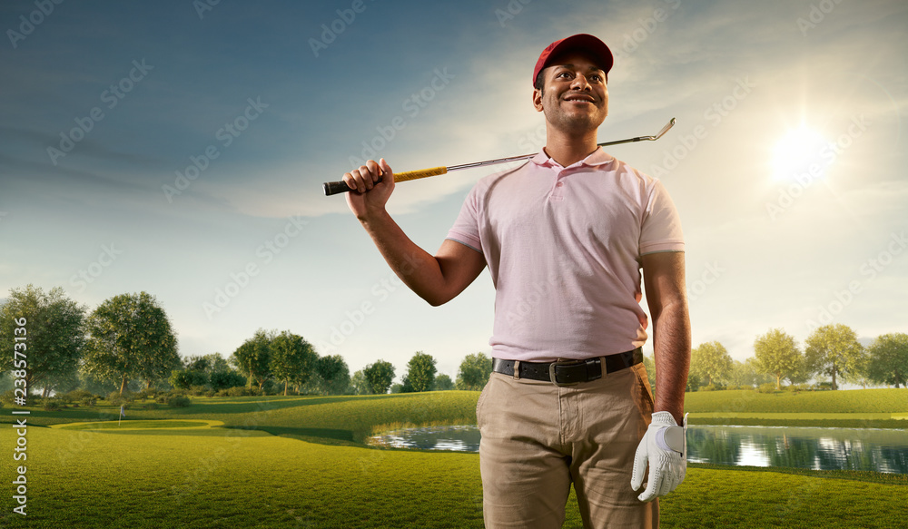 Male golf player on professional golf course. Smiling golfer on fairway
