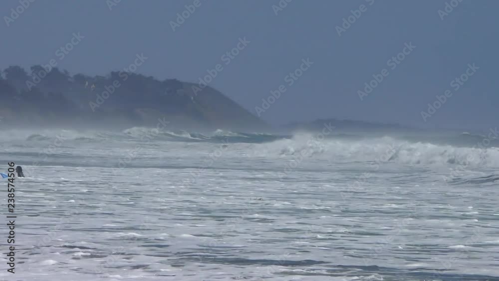 Unidentified surfers at Rio del Mar, Santa Cruz County, California, USA, on the 7th of June, 2018 Unidentified surfers at Rio del Mar, Santa Cruz County, California, USA, on the 7th of June, 2018
