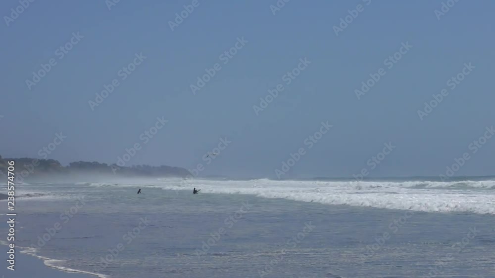 Unidentified surfers at Rio del Mar, Santa Cruz County, California, USA, on the 7th of June, 2018 Unidentified surfers at Rio del Mar, Santa Cruz County, California, USA, on the 7th of June, 2018