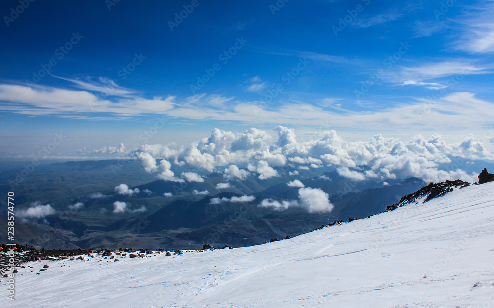 View from a height of 5000 meters from Mount Elbrus. Winter ascent to the highest point of Europe. Mountain climbing.